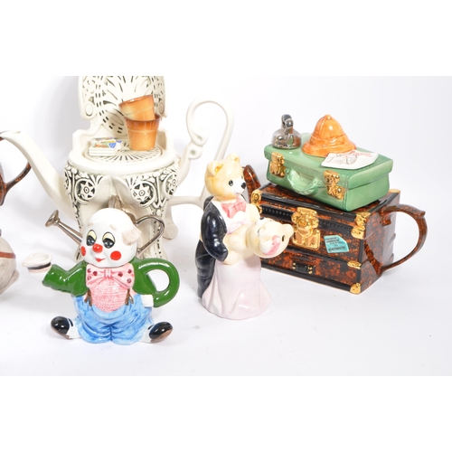 80 - A collection of eight vintage later 20th century novelty teapots. Comprising of a various examples; ... 