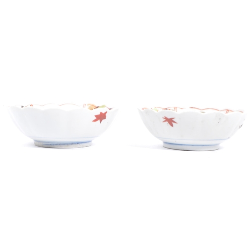 91 - A pair of early 20th century Chinese bowls with floral shaped rims, featuring six segments of patter... 