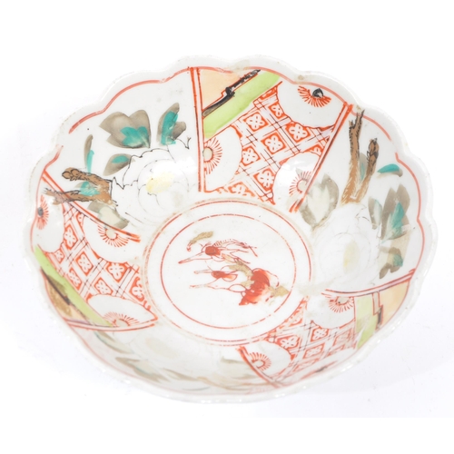 91 - A pair of early 20th century Chinese bowls with floral shaped rims, featuring six segments of patter... 