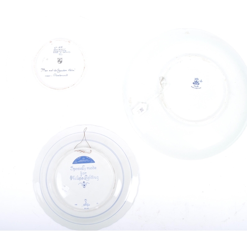 93 - Three early 20th century continental delftware blue & white chargers, to include one featuring a you... 