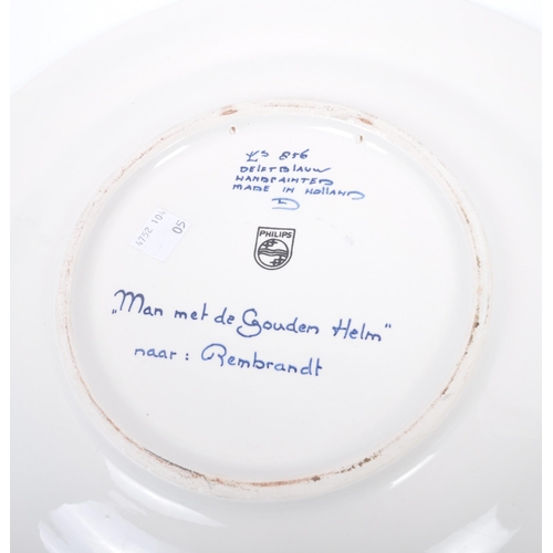 93 - Three early 20th century continental delftware blue & white chargers, to include one featuring a you... 