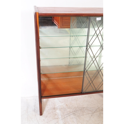 1052 - A vintage 20th century glazed display cabinet / bookcase. Rectangular form with lead sectional glaze... 