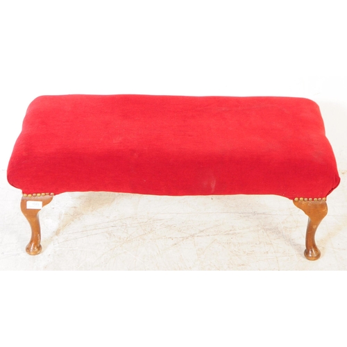 1053 - A vintage 20th century Queen Anne revival footstool. Of rectangular form with red material upholster... 