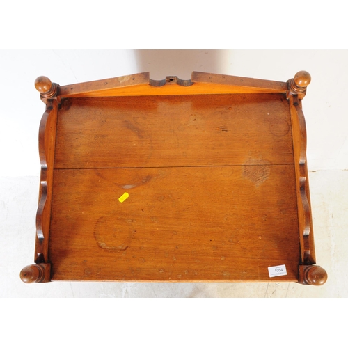 1054 - An early 20th century oak Edwardian music cabinet. Of rectangular form with shaped gallery back and ... 