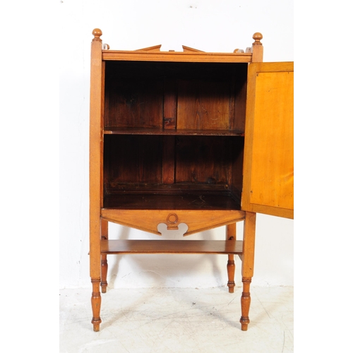 1054 - An early 20th century oak Edwardian music cabinet. Of rectangular form with shaped gallery back and ... 