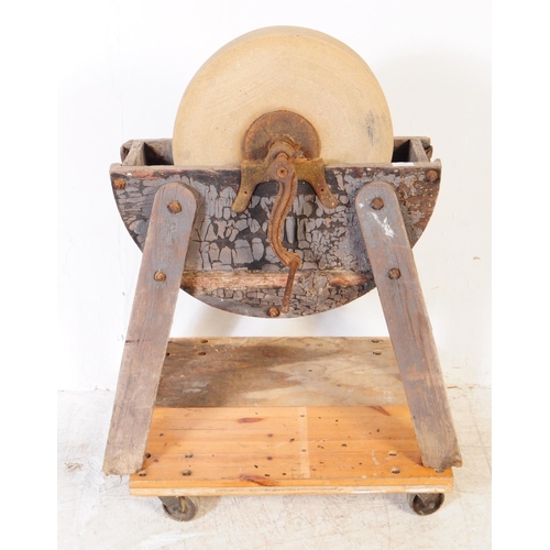 1066 - A Victorian 19th century knife / cleaver sharpening wheel. Having a wooden frame with four angled le... 