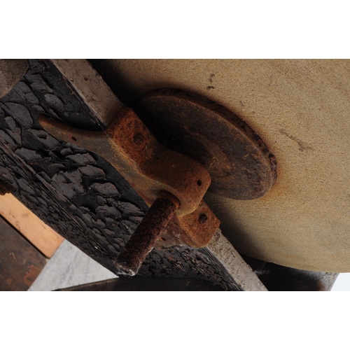 1066 - A Victorian 19th century knife / cleaver sharpening wheel. Having a wooden frame with four angled le... 