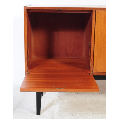 550 - Nathan Furniture - A retro mid 20th century teak veneered sideboard credenza. Of rectangular form wi... 
