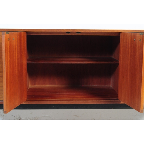 550 - Nathan Furniture - A retro mid 20th century teak veneered sideboard credenza. Of rectangular form wi... 