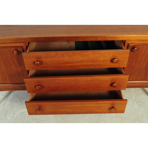 551 - Stonehill Furniture - A vintage mid 20th century teak wood sideboard credenza. Of rectangular form w... 