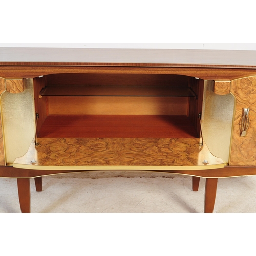 552 - Beautility Furniture - A mid 20th century walnut veneered Formica sideboard credenza. Of rectangular... 