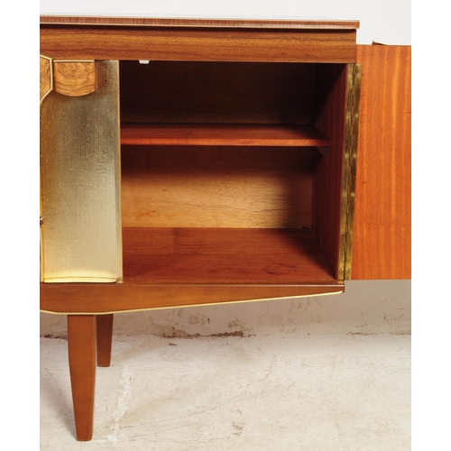 552 - Beautility Furniture - A mid 20th century walnut veneered Formica sideboard credenza. Of rectangular... 