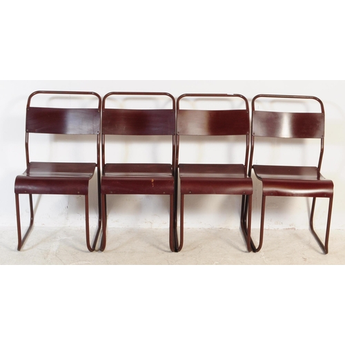 557 - A set of seven Du-al retro mid 20th century stacking industrial school chairs. Having tubular metal ... 