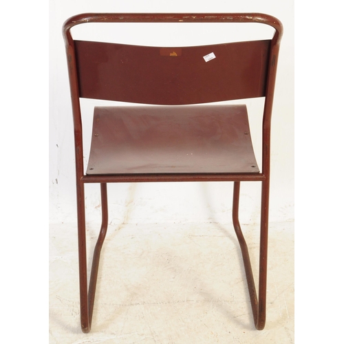 557 - A set of seven Du-al retro mid 20th century stacking industrial school chairs. Having tubular metal ... 