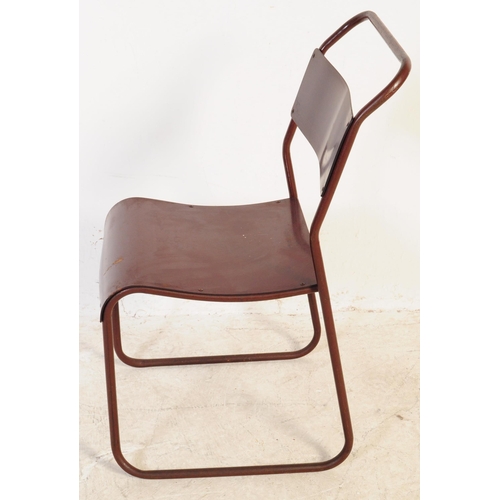 557 - A set of seven Du-al retro mid 20th century stacking industrial school chairs. Having tubular metal ... 