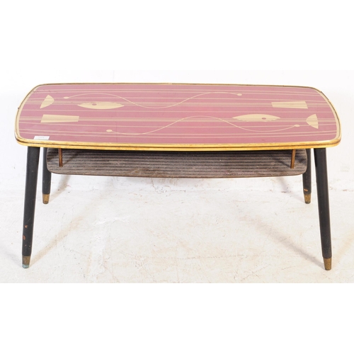 571 - British Modern Design - A mid century retro coffee occasional table. Red rectangular top with gilt f... 