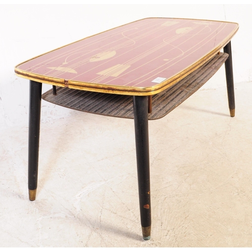 571 - British Modern Design - A mid century retro coffee occasional table. Red rectangular top with gilt f... 