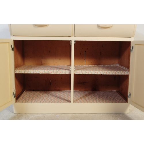 574 - Remploy - A retro mid 20th century Remploy cream kitchen unit / sideboard. The sideboard having cant... 