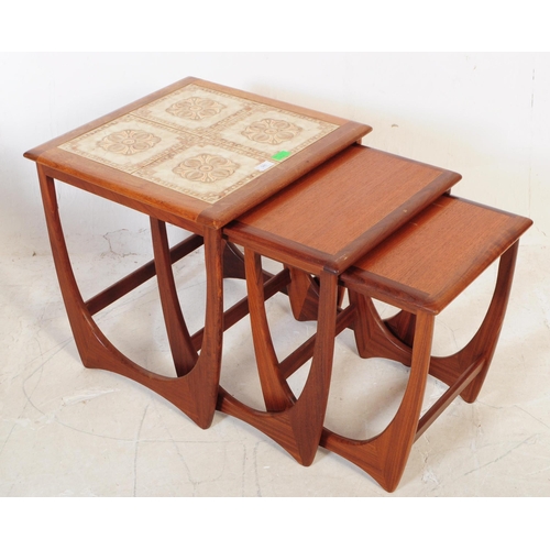 585 - G-Plan Furniture - A 1970's G-Plan ' Astro ' teak wood nest of tables. The tables of graduating form... 