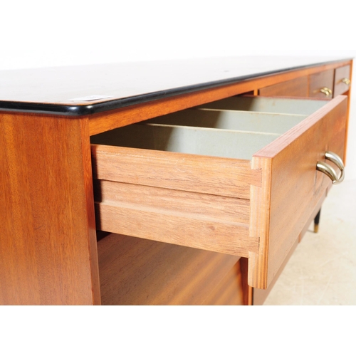 591 - Avalon Yatton - A retro mid 20th century walnut veneered sideboard credenza. Having pull down cabine... 