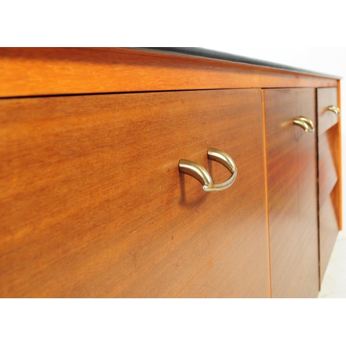 591 - Avalon Yatton - A retro mid 20th century walnut veneered sideboard credenza. Having pull down cabine... 