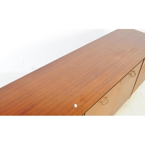 591 - Avalon Yatton - A retro mid 20th century walnut veneered sideboard credenza. Having pull down cabine... 