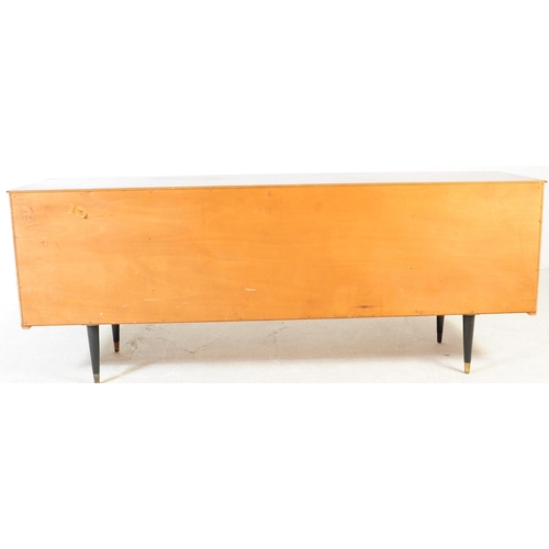 591 - Avalon Yatton - A retro mid 20th century walnut veneered sideboard credenza. Having pull down cabine... 