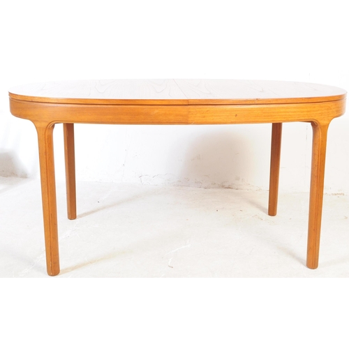 593 - Nathan Furniture - A vintage mid 20th century teak extending dining table and chairs. Of curved rect... 