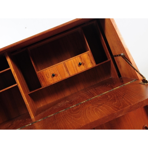 598 - British Modern Design - A mid 20th century retro teak writing bureau. Rectangular form with pull dow... 