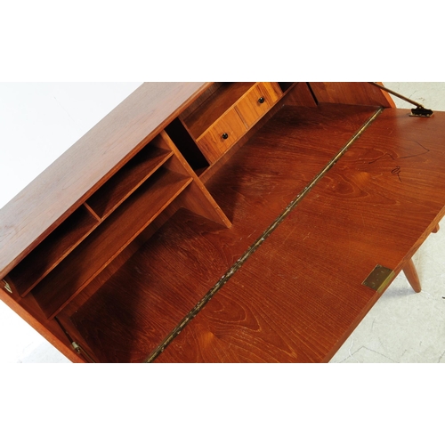 598 - British Modern Design - A mid 20th century retro teak writing bureau. Rectangular form with pull dow... 