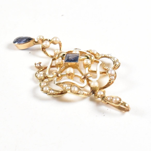 11 - An Edwardian 15ct gold enamel sapphire and pearl pendant. The pendant strung with a sapphire and pea... 