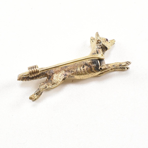 14 - A 19th century Victorian 15ct gold and ruby fox brooch pin. The brooch in the form of a running fox ... 