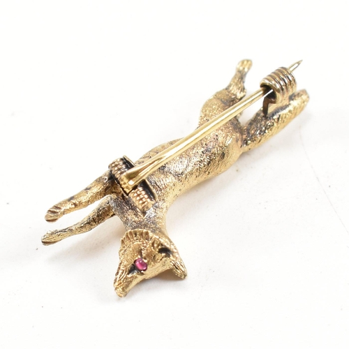 14 - A 19th century Victorian 15ct gold and ruby fox brooch pin. The brooch in the form of a running fox ... 