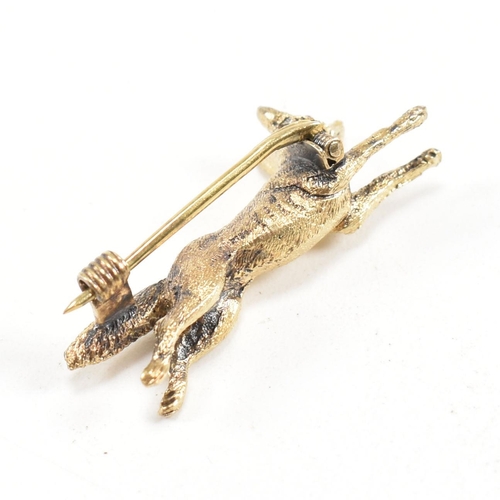 14 - A 19th century Victorian 15ct gold and ruby fox brooch pin. The brooch in the form of a running fox ... 