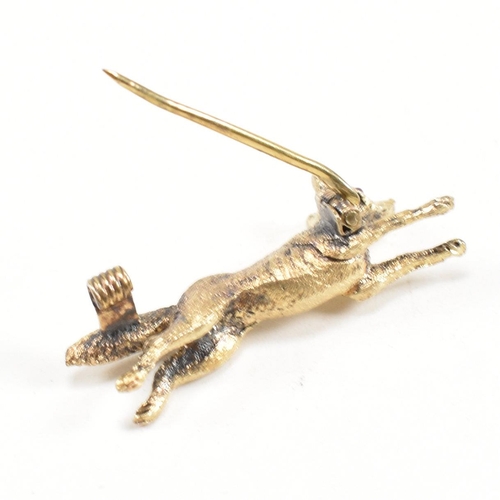 14 - A 19th century Victorian 15ct gold and ruby fox brooch pin. The brooch in the form of a running fox ... 