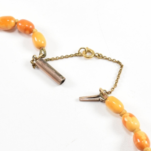 19 - A 1930S butterscotch amber bead necklace. The necklace strung with graduating beads from 2.2cm to 7m... 