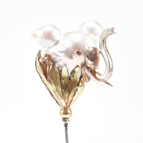 20 - An 18ct gold pearl elephant hat pin. The elephant formed of a baroque pearl having gem set eyes with... 