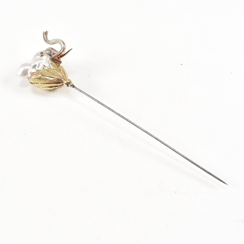 20 - An 18ct gold pearl elephant hat pin. The elephant formed of a baroque pearl having gem set eyes with... 