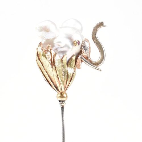 20 - An 18ct gold pearl elephant hat pin. The elephant formed of a baroque pearl having gem set eyes with... 