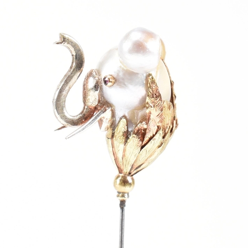 20 - An 18ct gold pearl elephant hat pin. The elephant formed of a baroque pearl having gem set eyes with... 