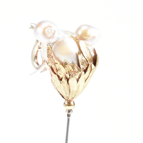 20 - An 18ct gold pearl elephant hat pin. The elephant formed of a baroque pearl having gem set eyes with... 