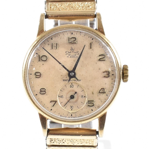 264 - Smiths Deluxe 15 jewels 9ct gold gentleman's wristwatch. 9ct gold case marked 375 with champagne dia... 