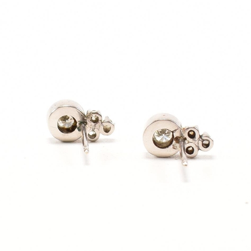 30 - A pair of 18ct white gold and diamond earrings. The earrings set with round brilliant cut diamonds s... 