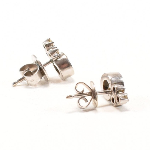 30 - A pair of 18ct white gold and diamond earrings. The earrings set with round brilliant cut diamonds s... 