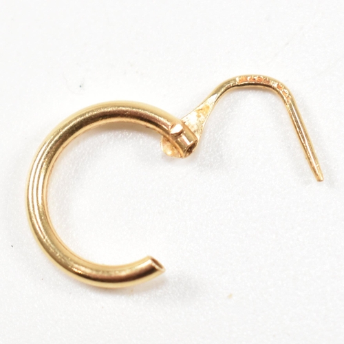 A pair of 18ct gold hoop earrings. The earringÿ having marks to lever