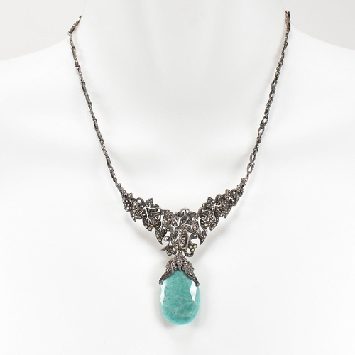 54 - A 1930s boxed Art Deco white metal marcasite and amazonite pendant necklace. The necklace strung wit... 