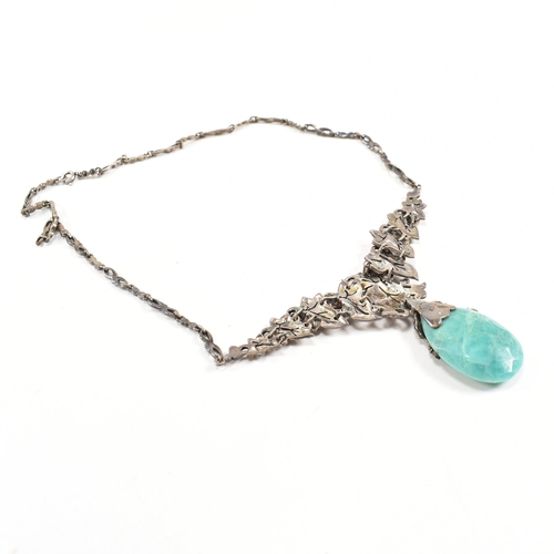 54 - A 1930s boxed Art Deco white metal marcasite and amazonite pendant necklace. The necklace strung wit... 