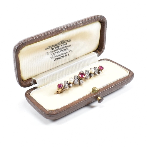 8 - An early 20th century ruby, diamond and pearl brooch pin. Principle ruby measures 4.6mm x 4.2mm x 2.... 