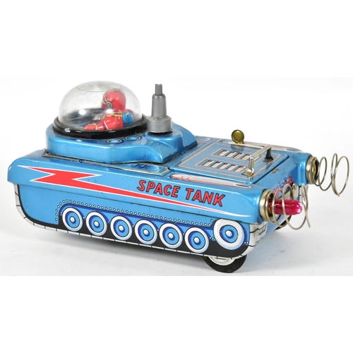 112 - A vintage Japanese ' Masudaya ' ( Modern Toys ) made tinplate battery operated Space Tank. Litho pri... 