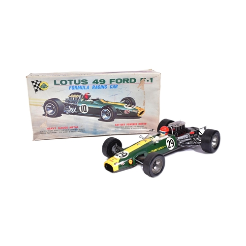 12 - Tinplate Toys - a vintage Japanese made tinplate battery operated model of a Lotus 49 Ford F-1 racin... 